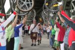 Walking under bike wheels for our processional