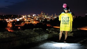 Me posing with the Please Cut our Budgets - We'll tell you how. This T-shirt scares providers but most peers get it right away.