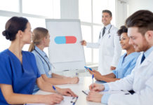 Turning the Corner: How Are We Educating Psychiatrists in Medical Schools? medical lecture pointing at pill drawing