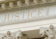UN Report: Involuntary Psychiatric Interventions “May Well Amount to Torture” the word justice engraved on a courthouse