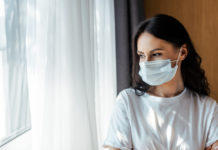 Loneliness Is Deadlier Than COVID woman wearing medical mask