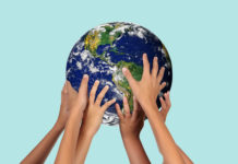 “We Are All Mad!” A Call for the Development of an International Network Among MAD Affiliates hands holding a globe