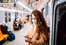 Is It Time to Rethink Mental Illness in Light of the Pandemic? woman wearing surgical mask on train