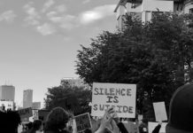 Black Suicidality and Mental Health #BlackLivesMatter protesters with a sign reading "silence is suicide"