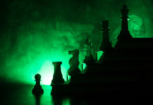 Identity, Oppression, and the Culture of “The Mentally Ill” chess pieces arranged on stairs