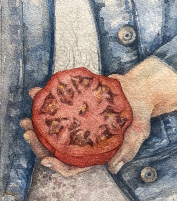 A woman holding a tomato