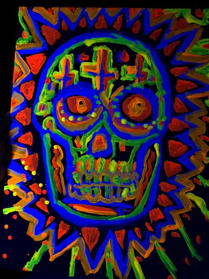 Florescent drawing of a blue and orange skull