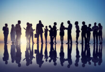 Soteria House and Peer Respite Summit Photograph, silhouettes of businesspeople gathering outdoors