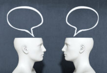 The Importance of Empathic Listening for Making Meaning of Distress 3d render of two heads with speech bubbles