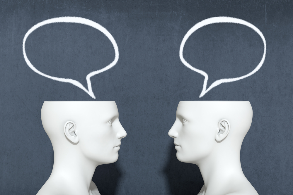 3d render of two heads with speech bubbles