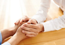 Peer Respite: Why It Should be Everyone’s Concern Close up photo of hands being held