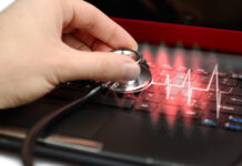 “Make Psychiatry Healthy”: Analysis of a Leaflet From the Danish Psychiatric Association Close up of a stethoscope held to a computer, with a red diagnostic glowing out from it