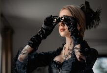 “For Life”: New Opera Tells the Stories of Those Harmed by Psychiatric Drugs Woman in old-fashioned black gown holds opera glasses to her eyes