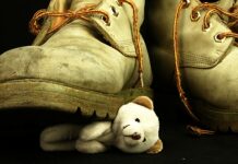 Getting A Diagnosis Meant That My Sister Never Had the Chance to Resolve Her Trauma A photo of a teddy bear being stepped on by a work boot