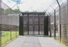 Inside a Forensic Psychiatry Unit: The Ground Where Death Meets Life Photograph of a modern prison's front gate