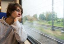 Patient Reports Reveal SSRI Antidepressants Often Lead to Emotional Blunting Bored young man, staring out the train window on a rainy, grey and dull day