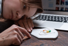 Antidepressants Do Not Improve Quality of Life Image of a young girl looking at a handful of antidepressants.