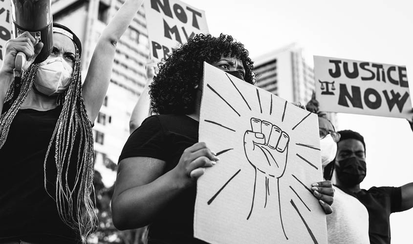 Protestors holding signs