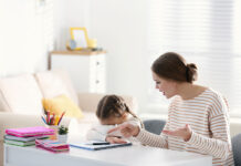 A Therapist Tried to Explain CBT When I Was 11 Years Old, Ineffectively Stock photo of unhappy little girl; adult woman is trying to make her do worksheets