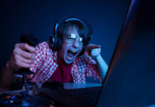 What Video Games Can Teach Us About Effective Parenting teen boy playing video game intensely