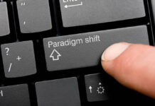 Are We Witnessing the Emergence of a New Paradigm? Close-up photo of the shift button on a computer keyboard, but it's labeled "Paradigm shift."