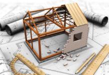 Feel Hopeless About Reforming a Broken System? Incremental Change Is Still Change 3D illustration of a model house in construction on a table of blueprints