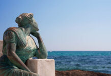 We’re Obsessed with Labelling Suffering, But Our Power to Think about it Matters More Photo of a sculpture of a woman on a bench looking wistfully out to sea