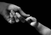 Mad/Cripistemologies of Pandemic Parenting: Insights for Our “Post-COVID-19” Present Hands of mother and baby closeup