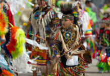 A Case Before the U.S. Supreme Court Could Surge the Psychiatric Labelling and Drugging of Native American Foster Youth Milwaukee, Wisconsin, USA - September 8, 2018 The Indian Summer Festival, Child wearing traditional native american clothing, dancing at the pow wow competition.