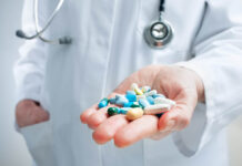 Critical Psychiatry Textbook, Chapter 7: Psychosis (Part Five) Hand of doctor holding many different pills