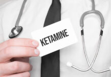Ketamine Fails to Beat Active Placebo for Depression Doctor holding a card with text ketamine