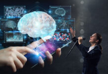 Big Tech CEOs Meet with Psychiatry’s Leaders to Decide the Future of Mental Health Young businesswoman speaking in microphone. Giant imagery of glowing brain and statistics emanating from a cell phone projected behind her