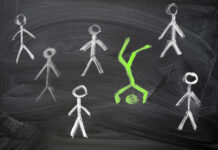 Unattached Burdens: IFS Helps Us Understand What Psychiatry Ignores Green stick figure, chalk on a blackboard, standing on its head, amid a crowd of identical white stick figures