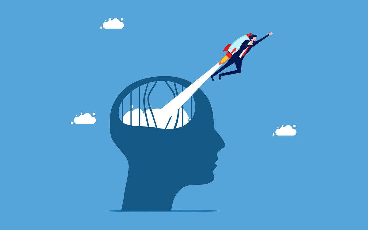Vector illustration. Head shape with broken prison bars; a man in a suit launches out on a jetpack into a blue sky with clouds.