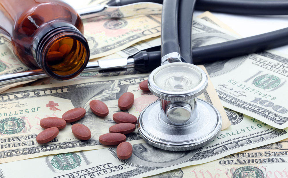 Medical Stethoscope and Pills on Dollars