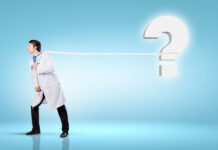 Much of U.S. Healthcare Is Broken: How to Fix It (Chapter 1, Part 1) Image of male doctor pulling question sign with rope