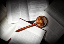 You Have the Legal Right to Informed Consent assorted open law books with legal gavel, in dramatic light
