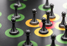 Toxic Interactions: Social Circumstances and Well-Being 3d illustration of pawns over black background with red, orange and green circles