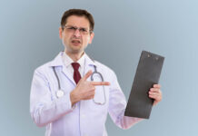 How the Medical Profession Pathologizes Emotions and the Damage to Patients Doctor looking perplexed or angry pointing at a clipboard