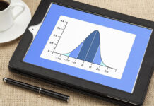 Bad Science Revisited: “The Bell Curve” Turns 30 A normal distribution curve appears on a tablet screen