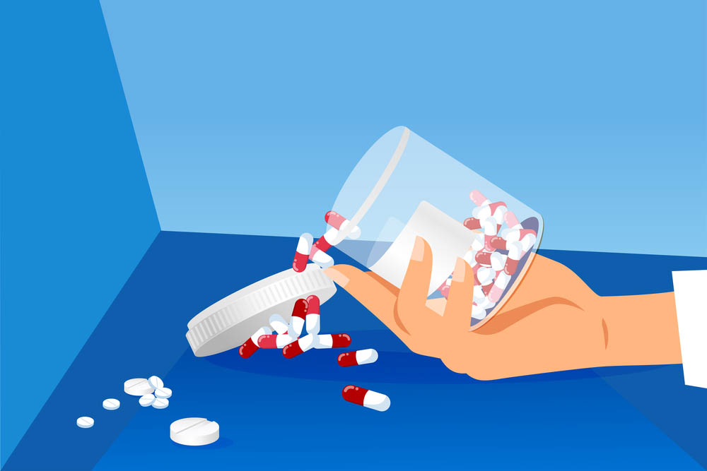 Vector illustration of an open pill bottle spilling red and white pills onto a blue floor from an outstretched pale hand.