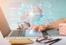 FDA-Approved Genetic Algorithm Fails to Predict Opioid Abuse Hands touching a laptop keyboard. A holographic brain with various charts and stats appears glowing above it