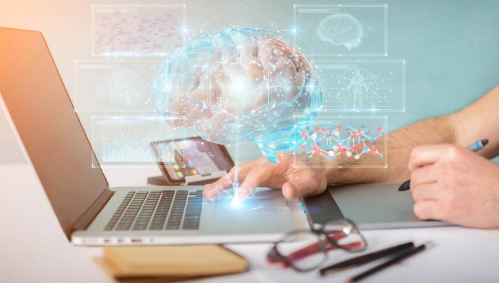 Hands touching a laptop keyboard. A holographic brain with various charts and stats appears glowing above it