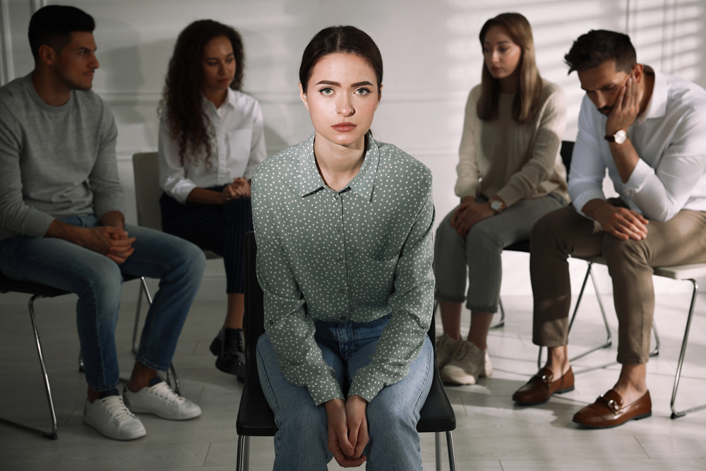 Photo of young woman in a therapy group