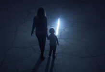 The Mental Health System in the UK Failed Us A woman and her child holding hands, walking in the dark toward a bright crack in the ground