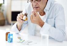 Elderly Patients Who Stop Antipsychotics Have Better Outcomes An elderly man takes a pill