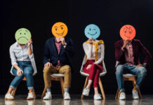 Waking Up to Your Emotions 101: The Other Side of Psychiatric Drug Withdrawal Photo of people holding round hand-drawn faces over their own faces, each depicting an emotion