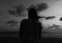 Where Is God When I Cut Myself? Soul Care and the Voices of Self-Injury Survivors Alone woman at the beach one twilight time looking out to sea