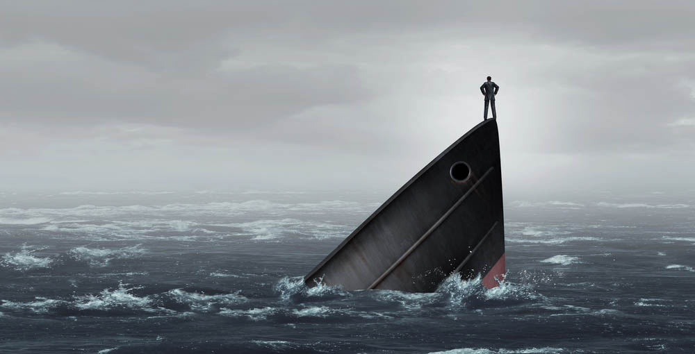 A man standing proudly on a sinking ship