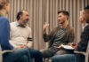 Open Dialogue and ODDESSI: What Have We Learned? Group of people sitting on chairs in circle and discussing some problems together during therapy lesson